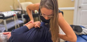 Dr. Magi Ziayan — Chiropractor Stuart FL Dr. Magi Ziayan treating a patient at Treasure Coast Spine and Sport Stuart FL